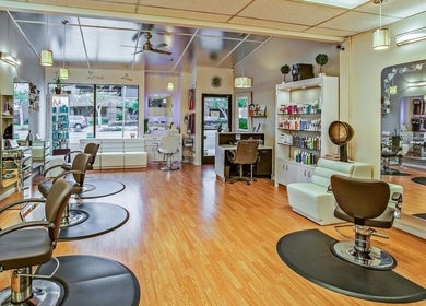 Bright interior of Decipher Hair Studio in Cebu City showcasing modern stations and products.