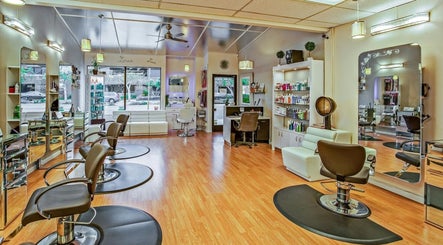 Bright interior of Decipher Hair Studio in Cebu City showcasing modern stations and products.