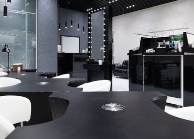 Modern interior of Decipher Hair Studio in Cebu City, Central Visayas, PH, showcasing stylish black and white decor.