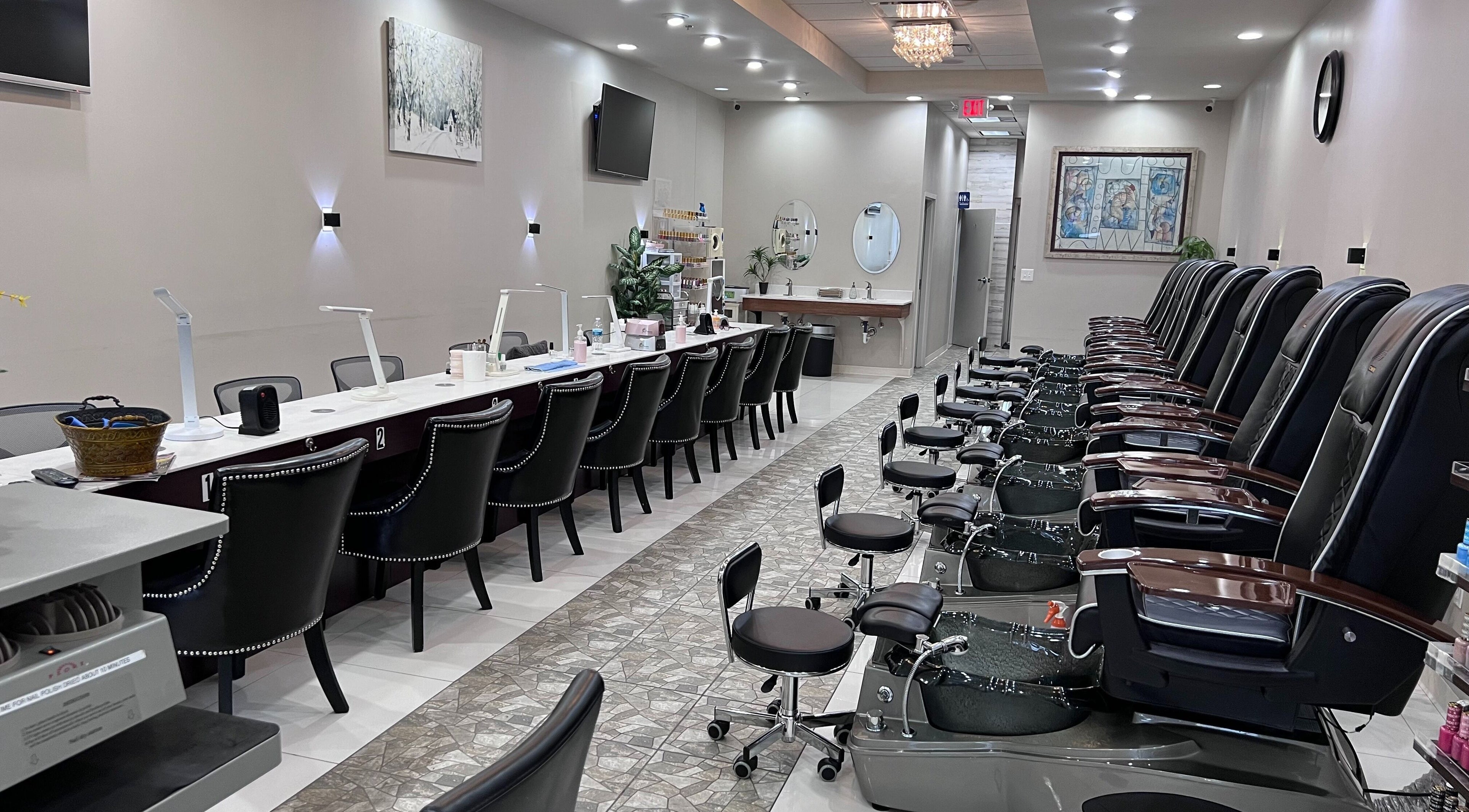 Spacious interior of Crystal Nail Spa (Westerville), Westerville, Ohio, US with luxury pedicure chairs and nail stations.