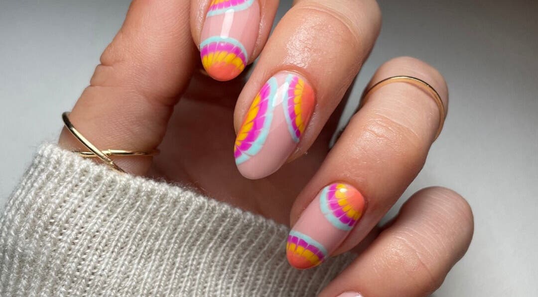 Colorful vibrant nail art at Mia's Beauty Bar, Earl Shilton, England, GB showcases intricate rainbow designs.