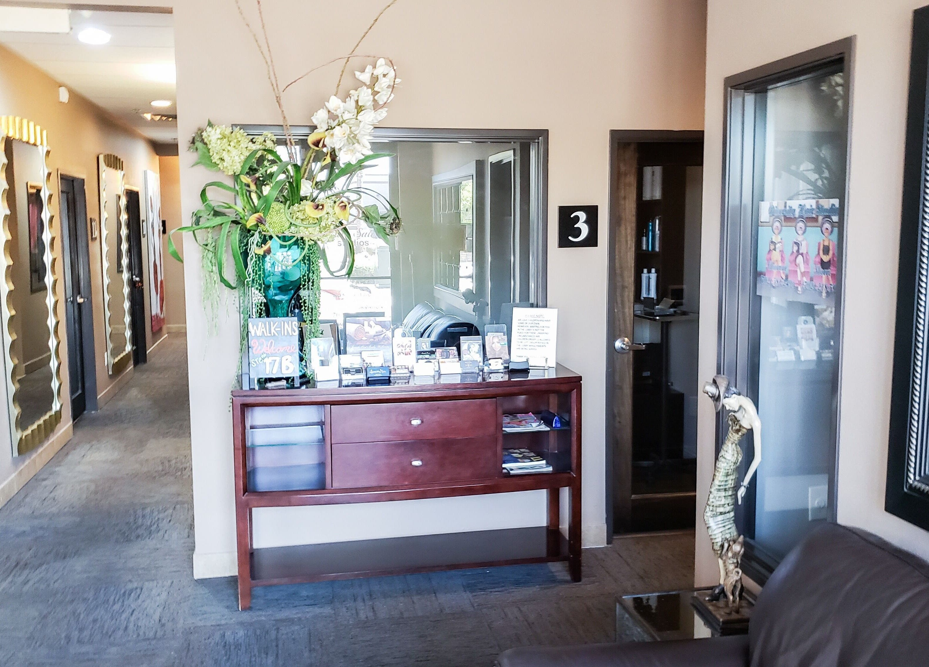 Chic entrance at Charity's Essentials Ageless Spa, Yuma, ARIZONA, US with elegant decor and mirrors.