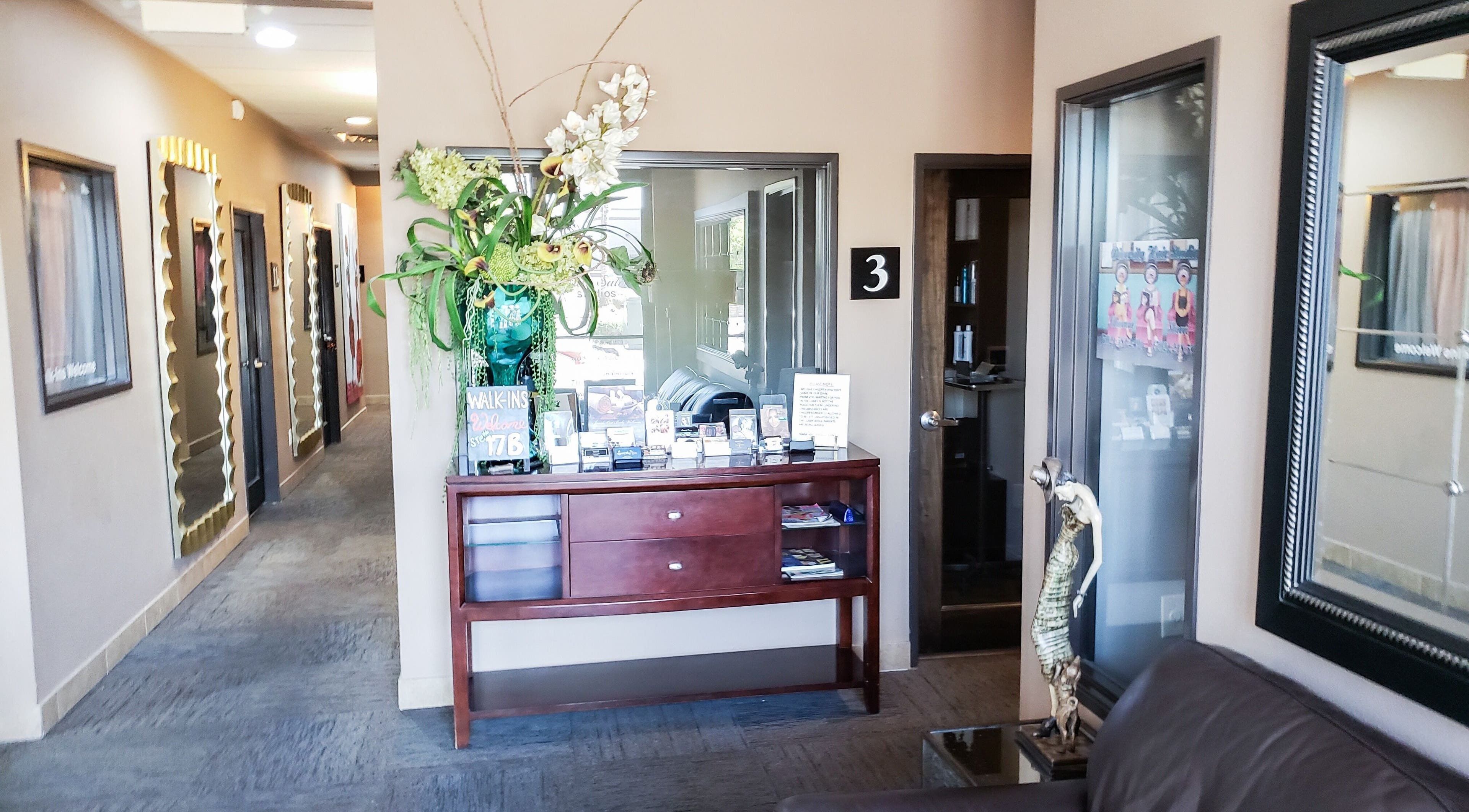 Chic entrance at Charity's Essentials Ageless Spa, Yuma, ARIZONA, US with elegant decor and mirrors.