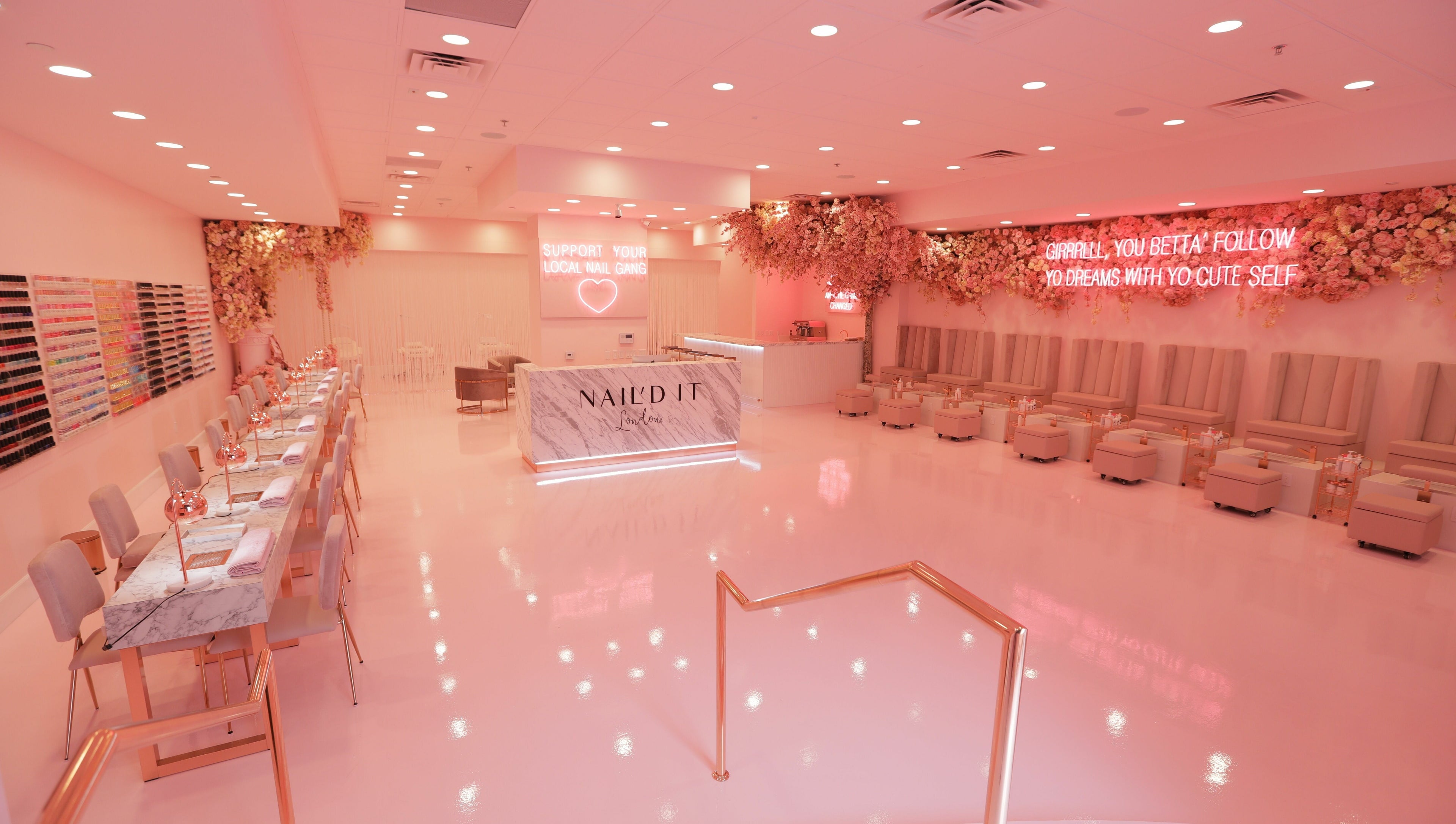 Luxurious Nail'd It London salon in Glendale, California, US with pink decor and elegant seating.