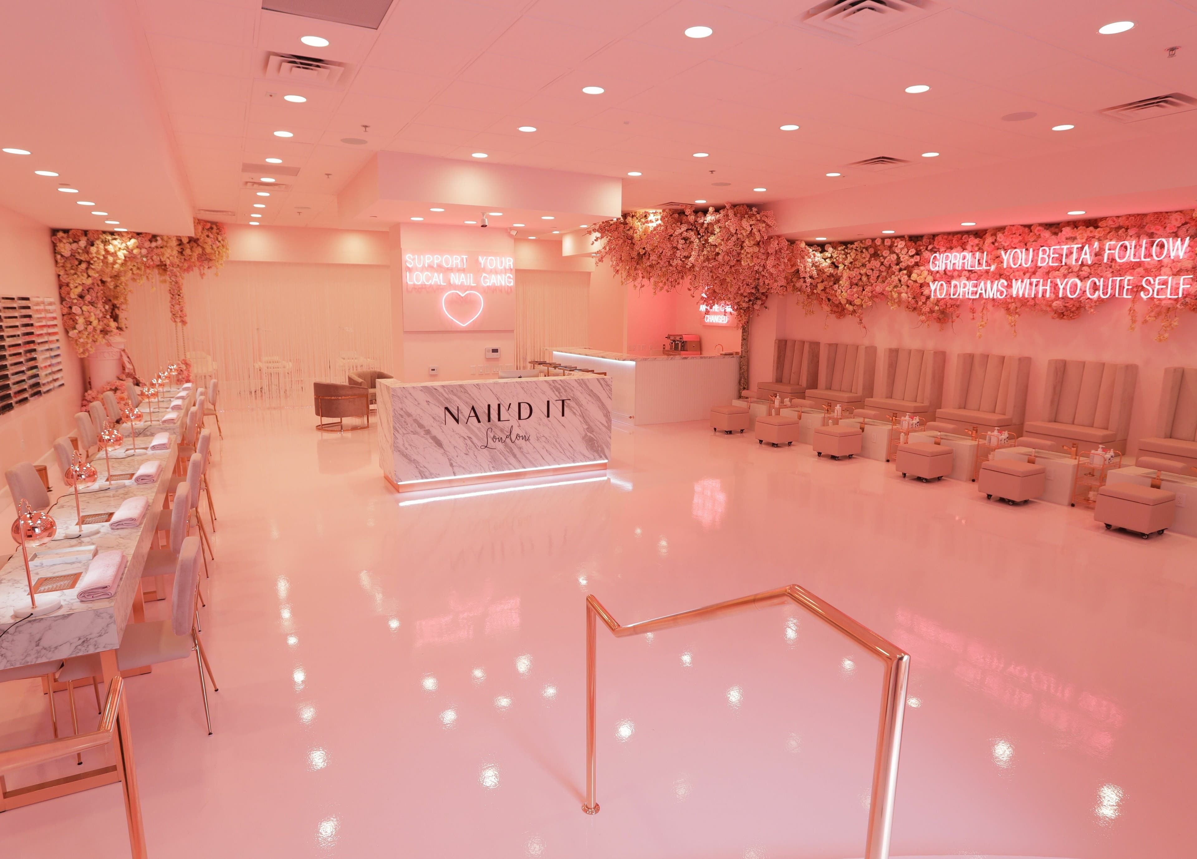 Luxurious Nail'd It London salon in Glendale, California, US with pink decor and elegant seating.