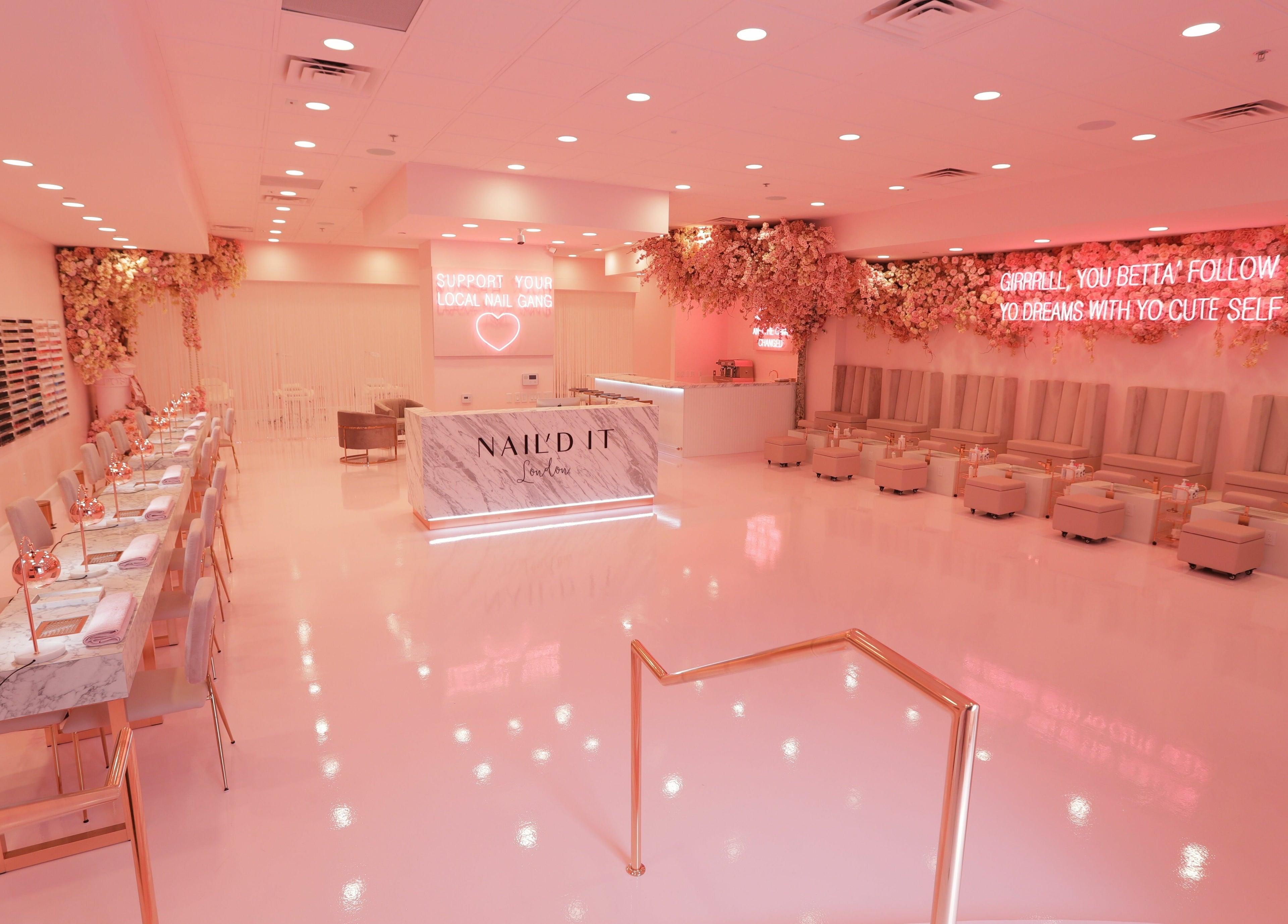 Luxurious Nail'd It London salon in Glendale, California, US with pink decor and elegant seating.