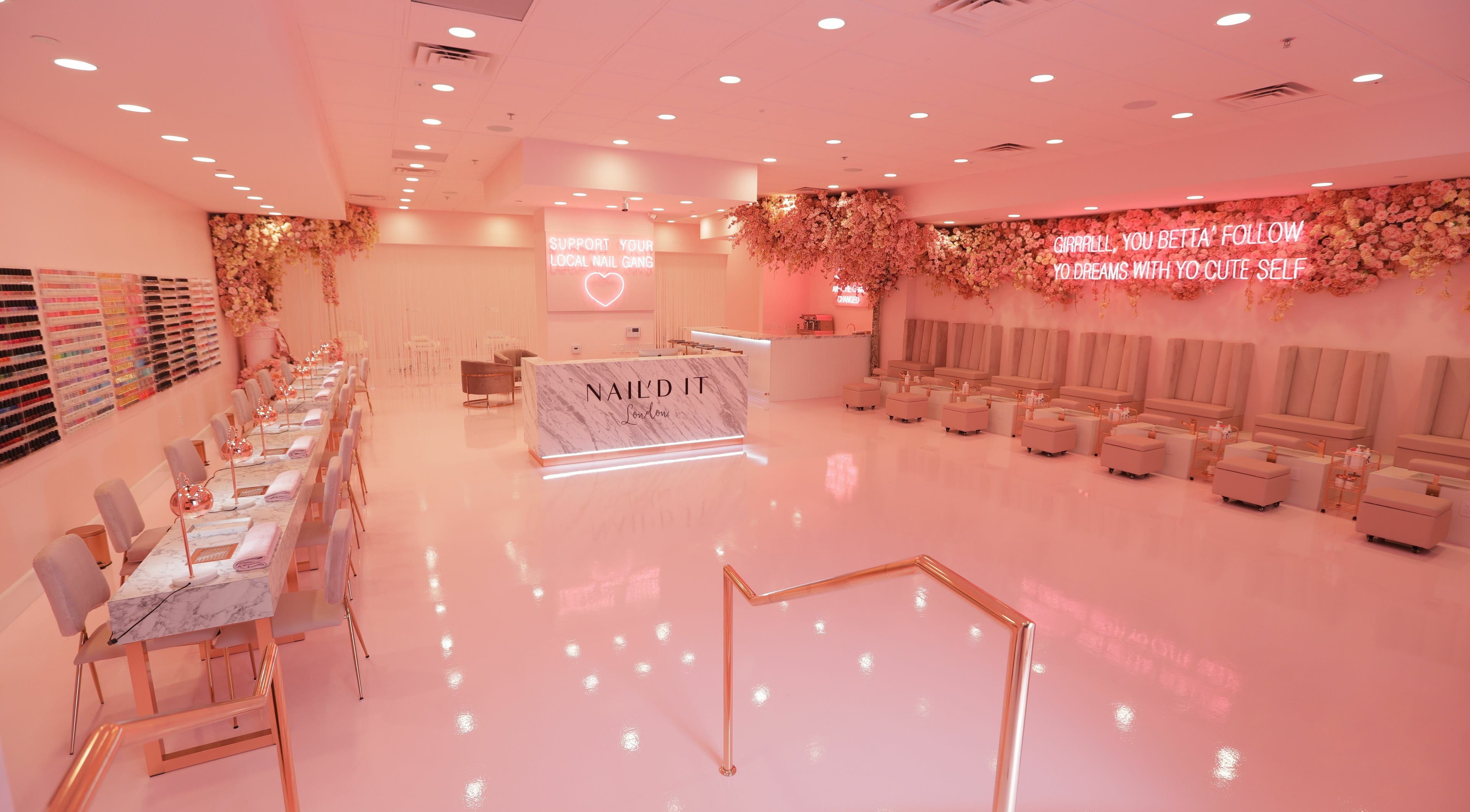 Luxurious Nail'd It London salon in Glendale, California, US with pink decor and elegant seating.