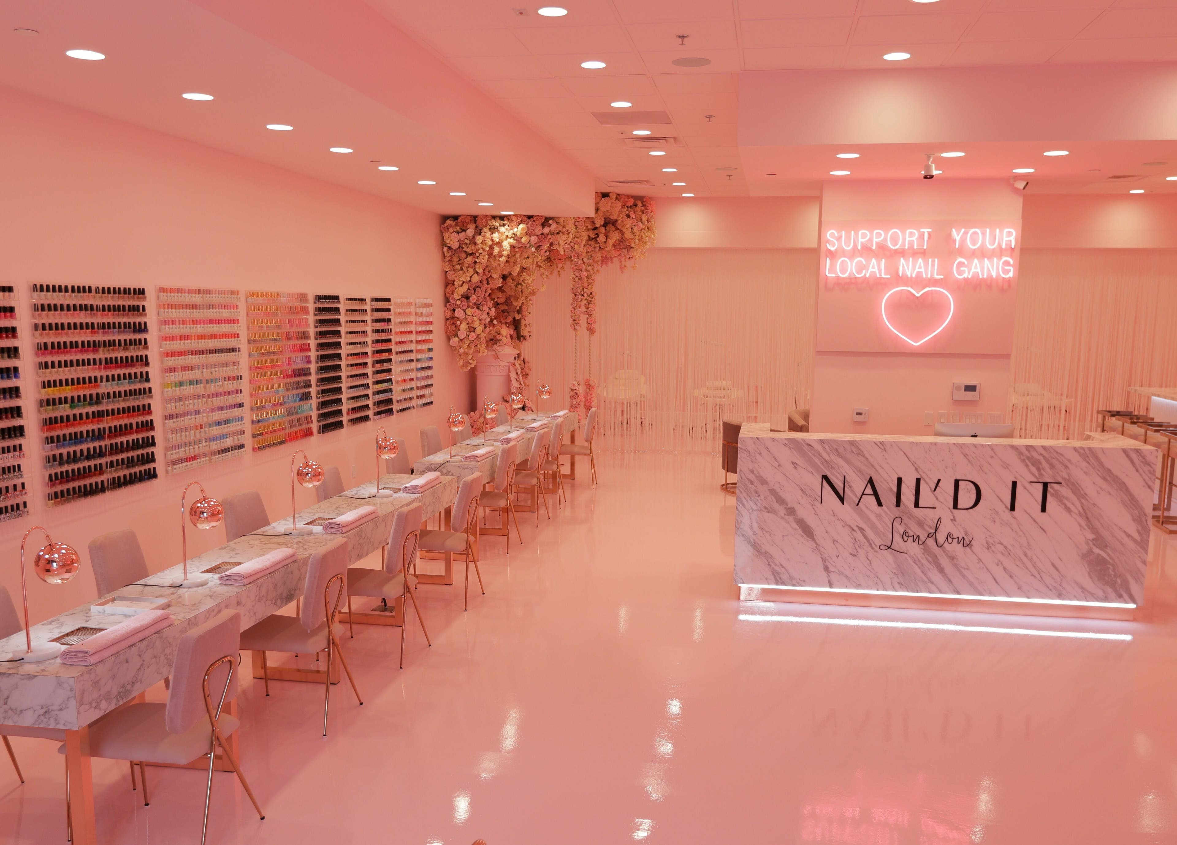 Chic interior of Nail’d It London in Glendale, California, US showcasing elegant nail bar and vibrant decor.