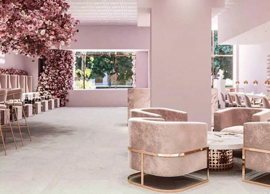 Chic interior of Nail'd It London in Glendale, California, US with plush seating and floral decor.