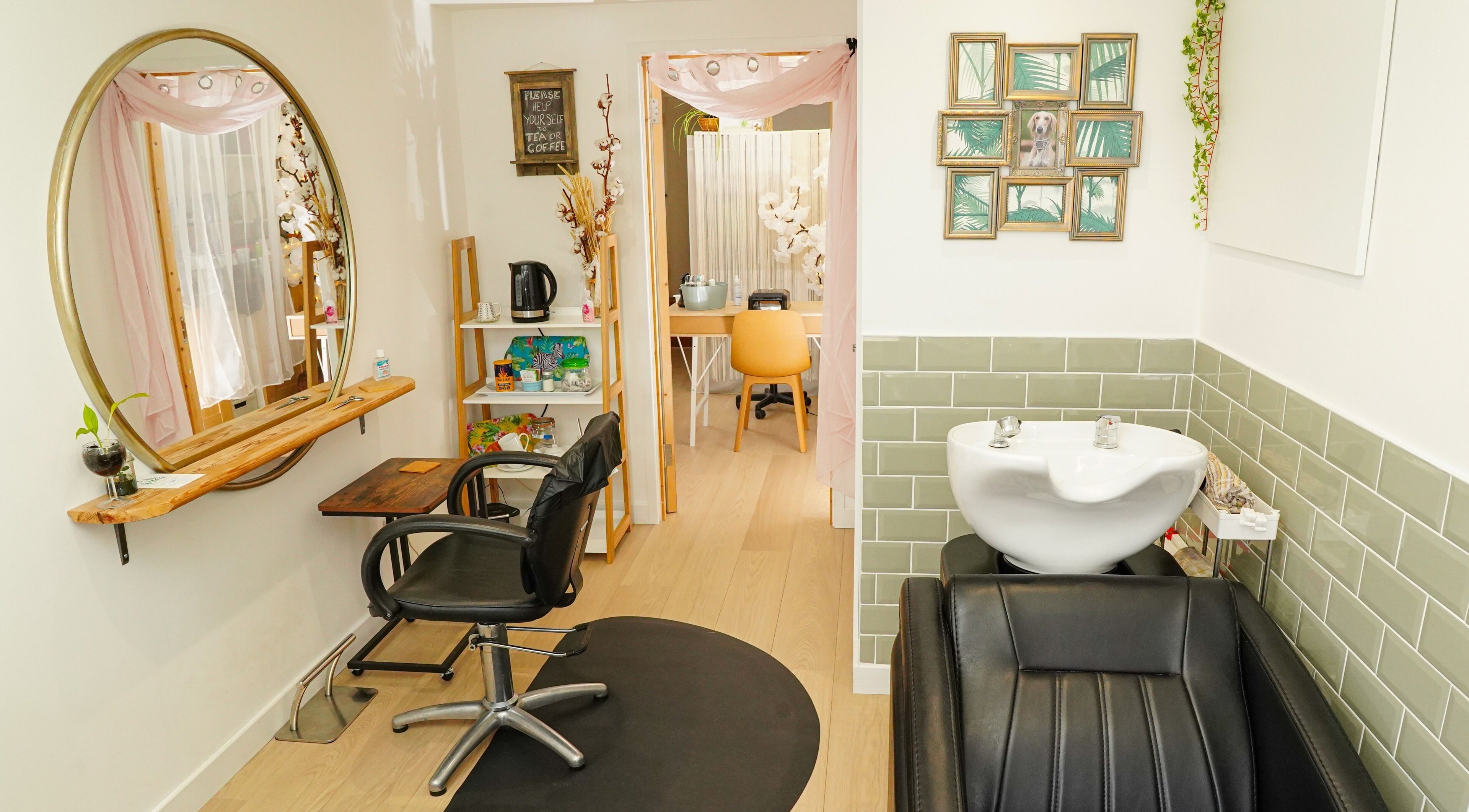 Cozy salon corner at The Green Room, Peacehaven, England, GB featuring a styling chair and sleek decor.