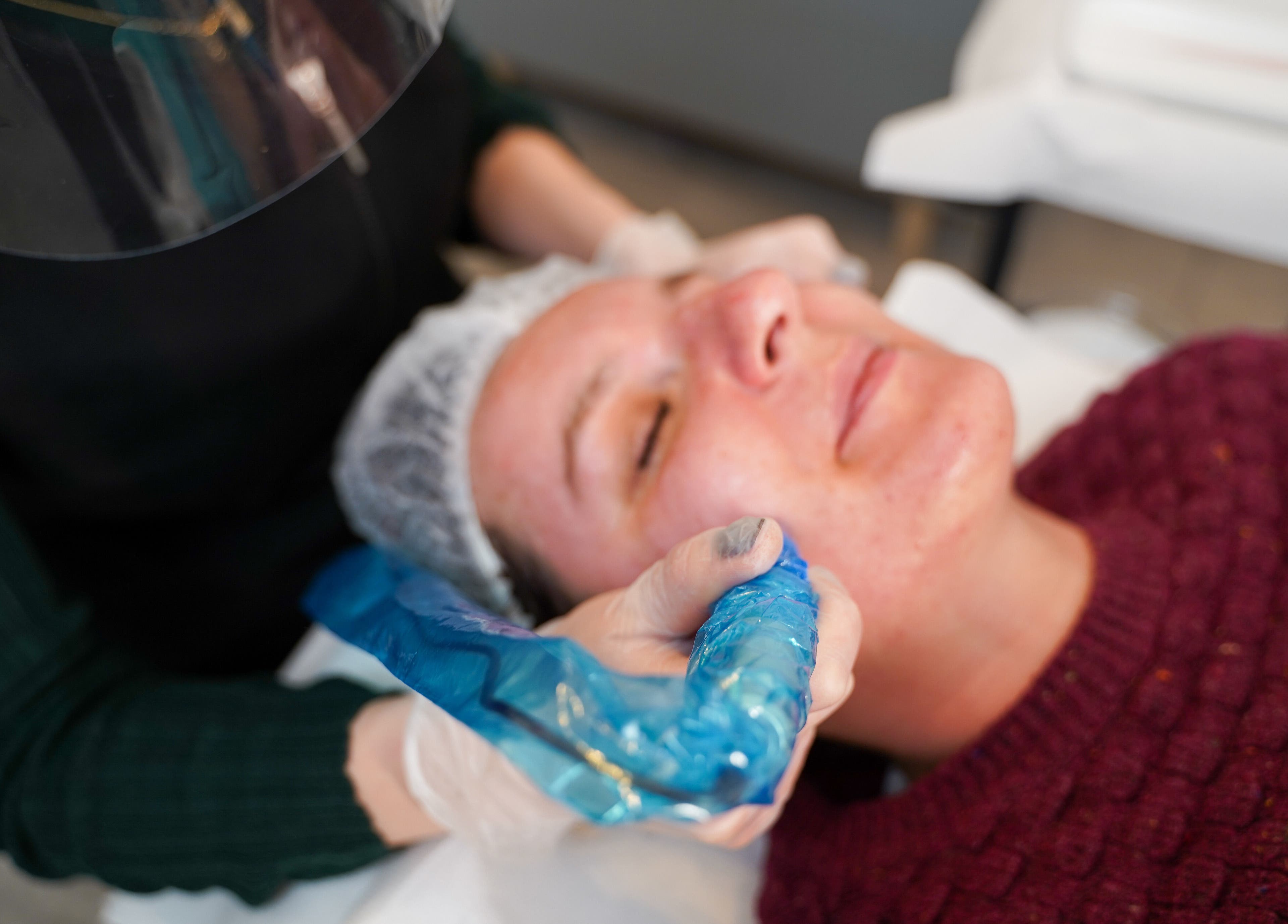 Facial treatment at Skin Aesthetic, Trowbridge, England, GB, showcasing expert care and client relaxation.