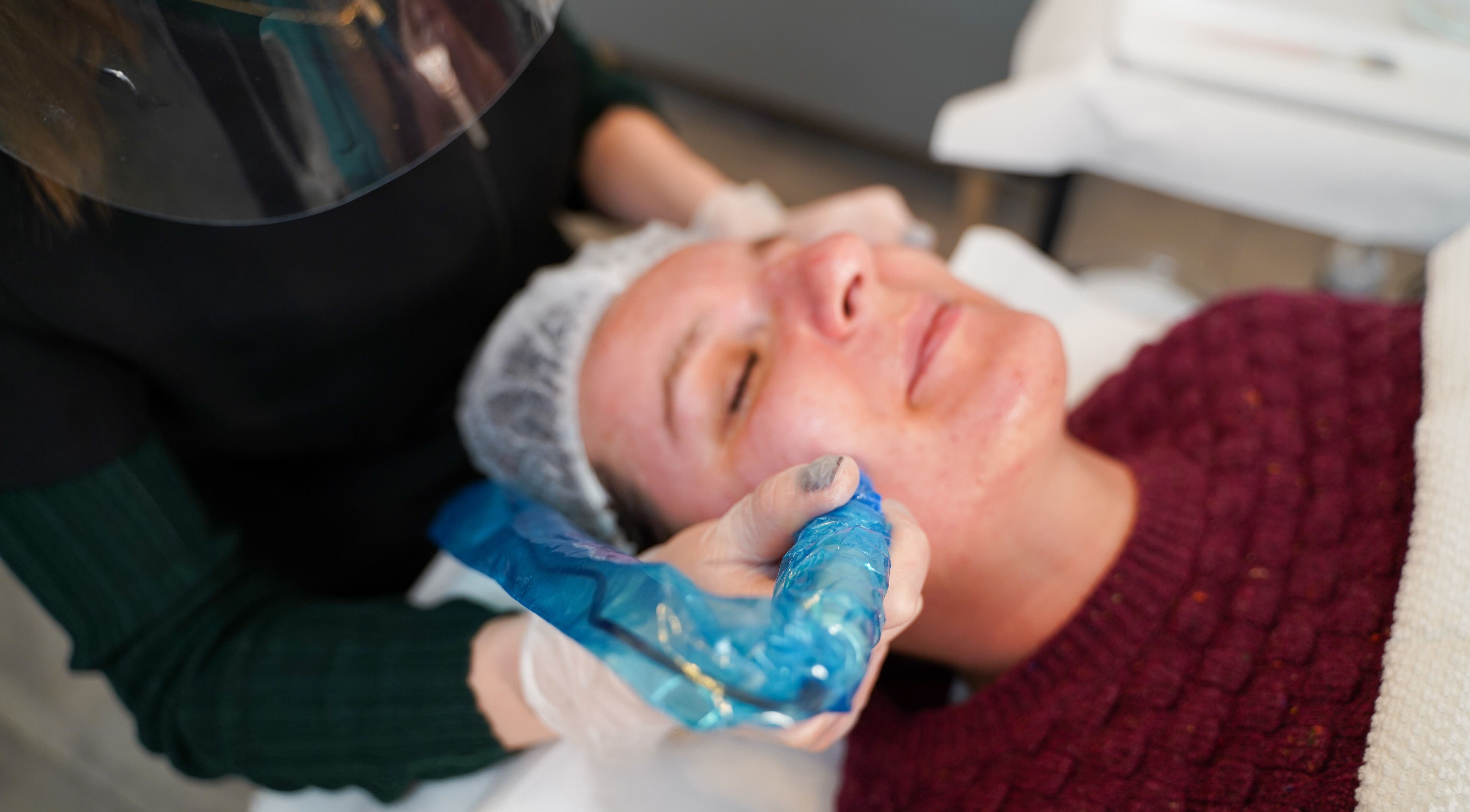 Facial treatment at Skin Aesthetic, Trowbridge, England, GB, showcasing expert care and client relaxation.