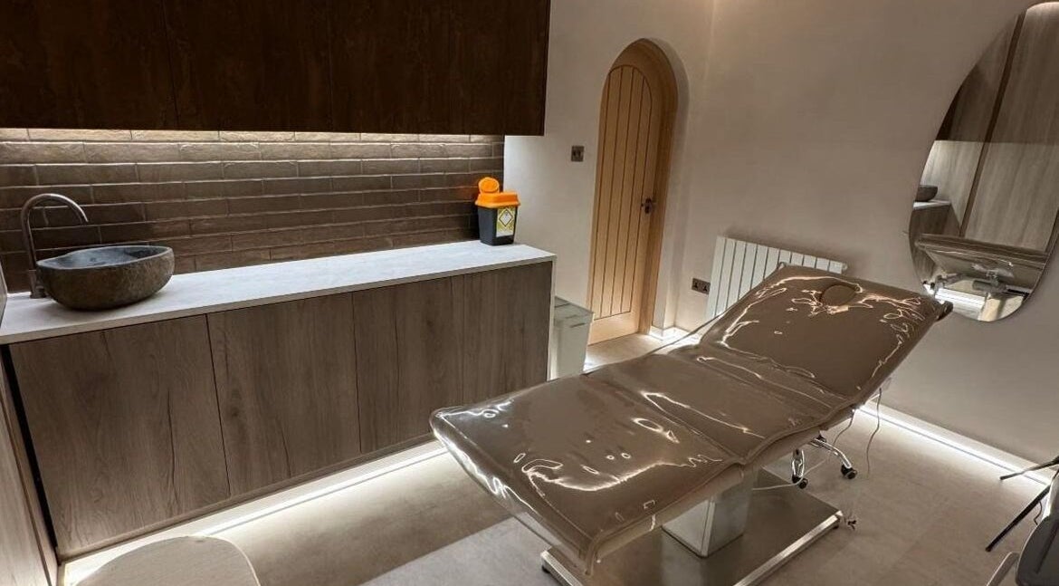 Modern treatment room at Lomas Laser & Beauty (MOSTON), Manchester, England, GB with a sleek design and comfort.