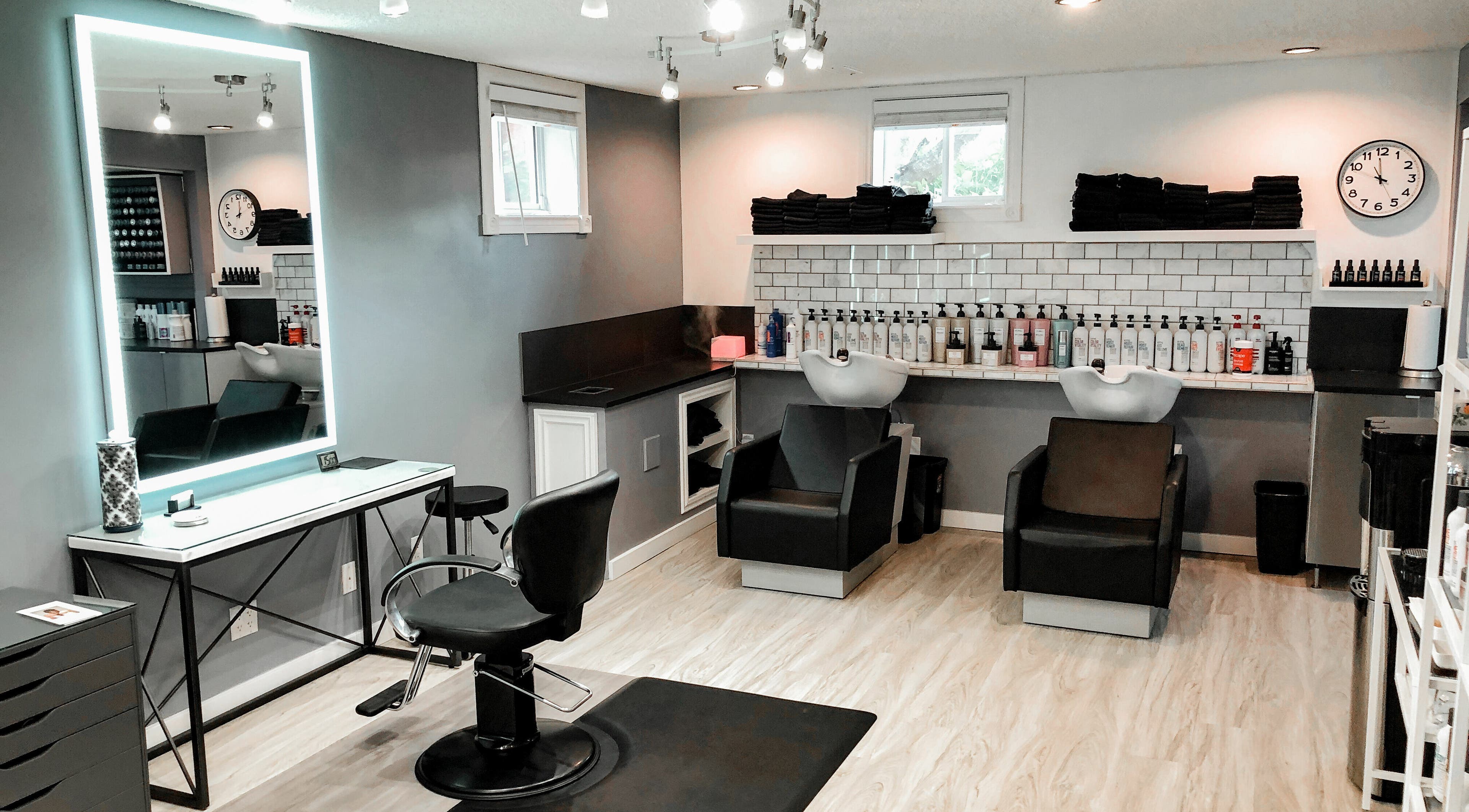 Elegant hair salon interior at Cast + Court, Slave Lake, Alberta, CA, featuring modern chairs and sleek design.