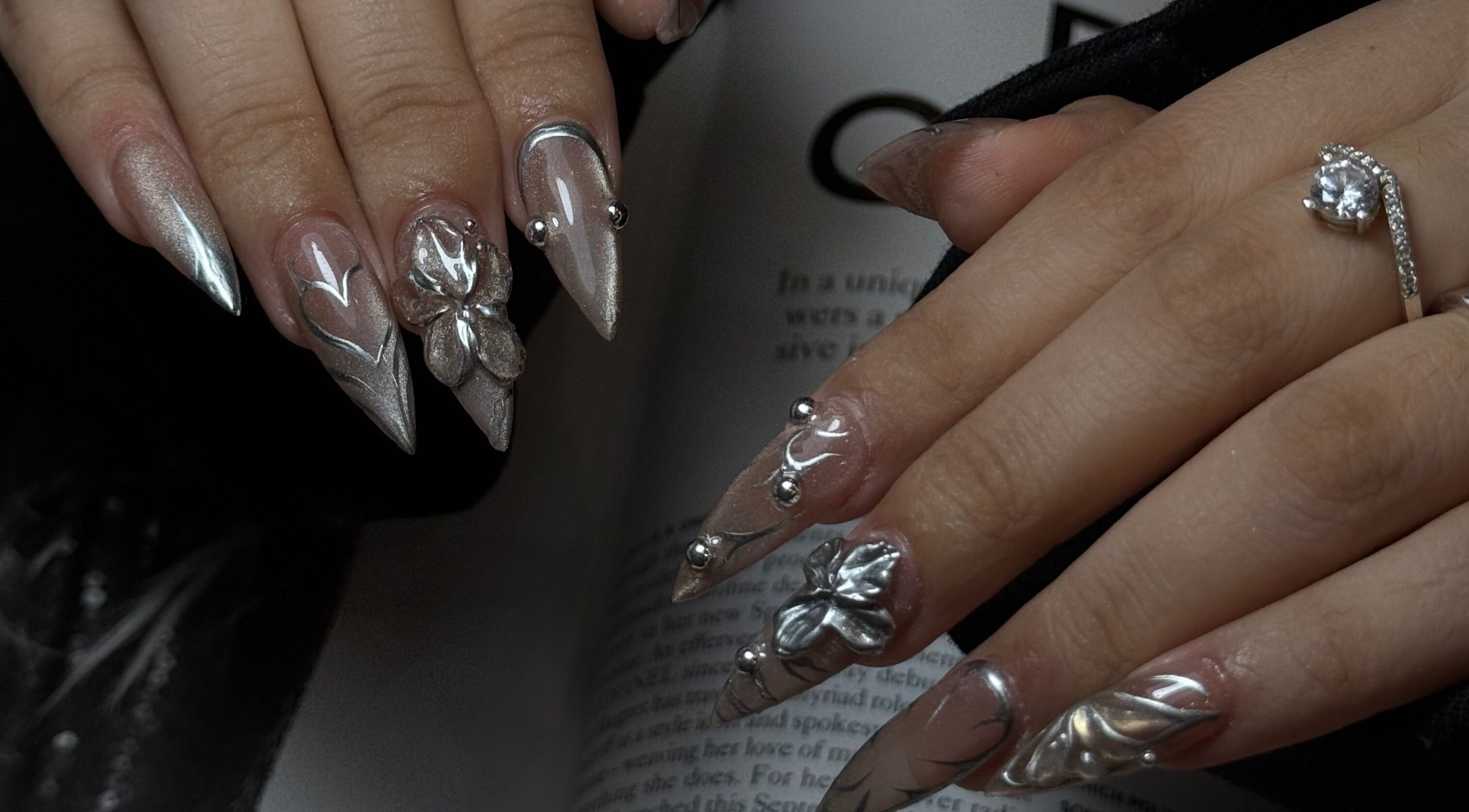 Stunning metallic nail art with 3D accents at Olux Nails Boutique, Melbourne, Victoria, AU.
