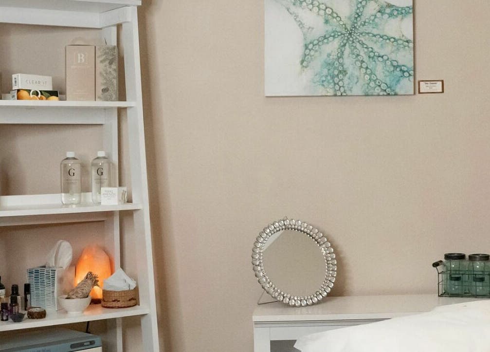 Tranquil spa corner at Sugar Maui, Kihei, Hawaii, US, featuring a beautifully arranged shelf with wellness products.