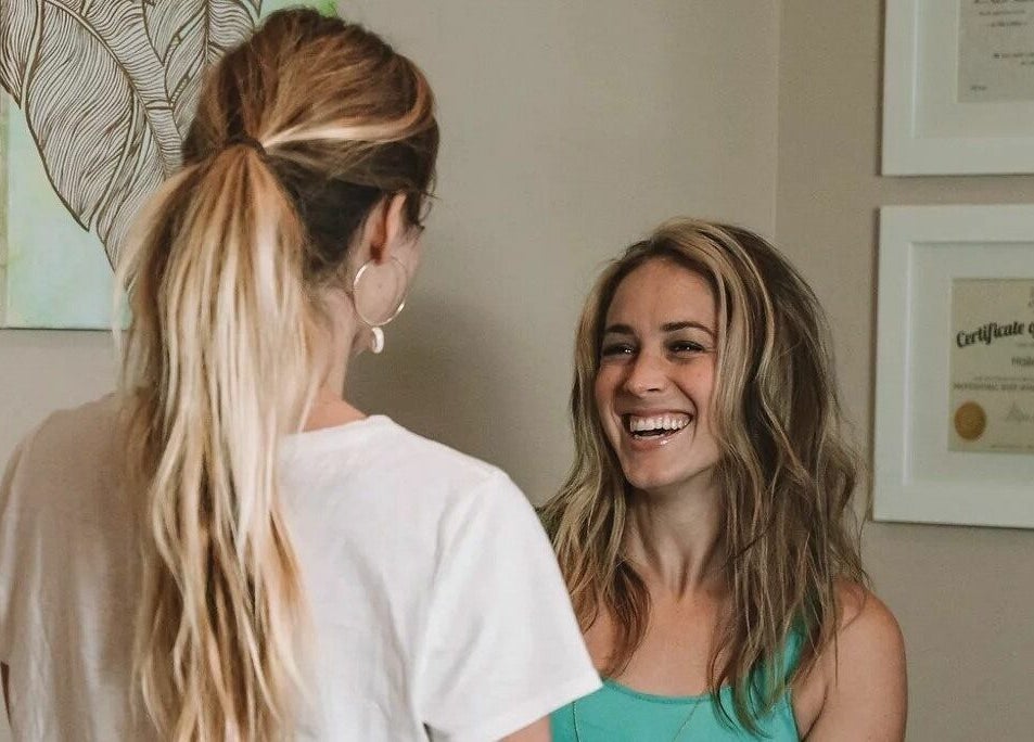 Two women happily interacting at Sugar Maui, Kihei, Hawaii, US, enhancing wellness experience.