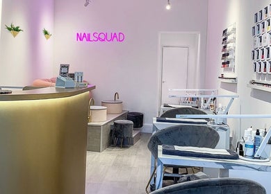 Modern nail salon interior at Nailsquad, Deal, England, GB with sleek design and vibrant decor.