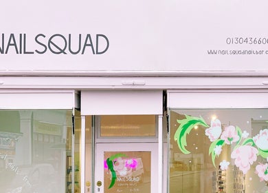 Exterior view of Nailsquad, a stylish nail salon in Deal, England, GB with decorative floral window art.