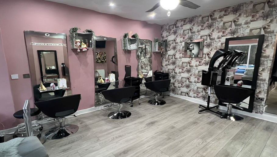Elegant interior of Rose Gold Hair & Beauty in Sheffield, England, GB, featuring stylish chairs and modern decor.