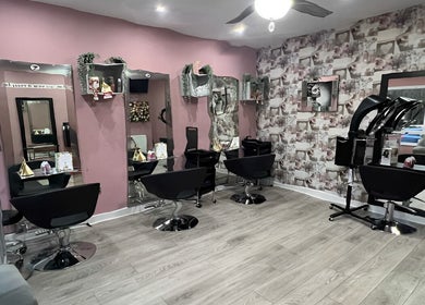 Elegant interior of Rose Gold Hair & Beauty in Sheffield, England, GB, featuring stylish chairs and modern decor.