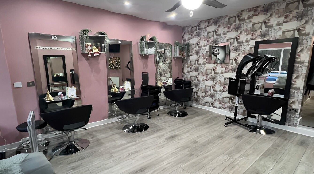 Elegant interior of Rose Gold Hair & Beauty in Sheffield, England, GB, featuring stylish chairs and modern decor.