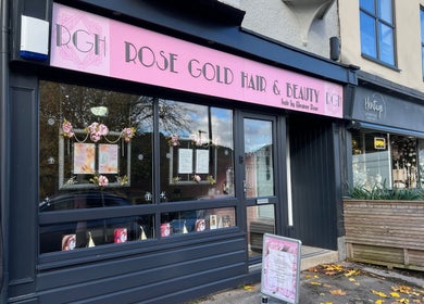 Exterior of Rose Gold Hair & Beauty in Sheffield, England, GB. Modern salon entrance with pink signage.