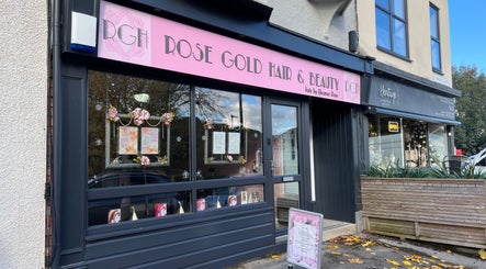 Exterior of Rose Gold Hair & Beauty in Sheffield, England, GB. Modern salon entrance with pink signage.