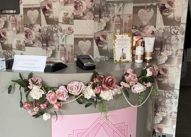 Elegant floral reception at Rose Gold Hair & Beauty, Sheffield, England, GB showcasing beauty products and decor.
