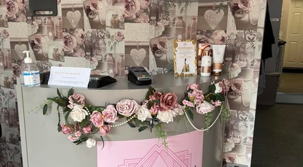 Elegant floral reception at Rose Gold Hair & Beauty, Sheffield, England, GB showcasing beauty products and decor.