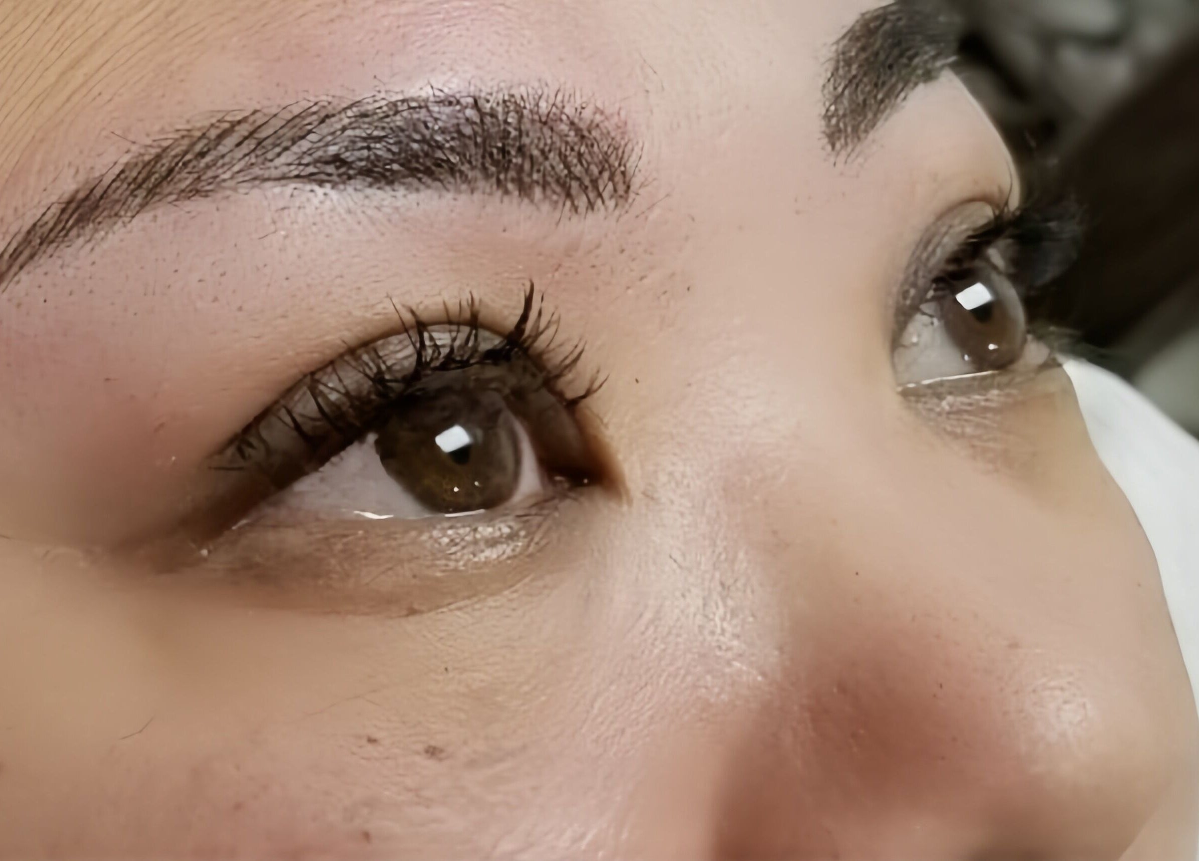 Close-up of expertly shaped brows and lashes at Lash n Brow by KT, Long Island City, New York, US.