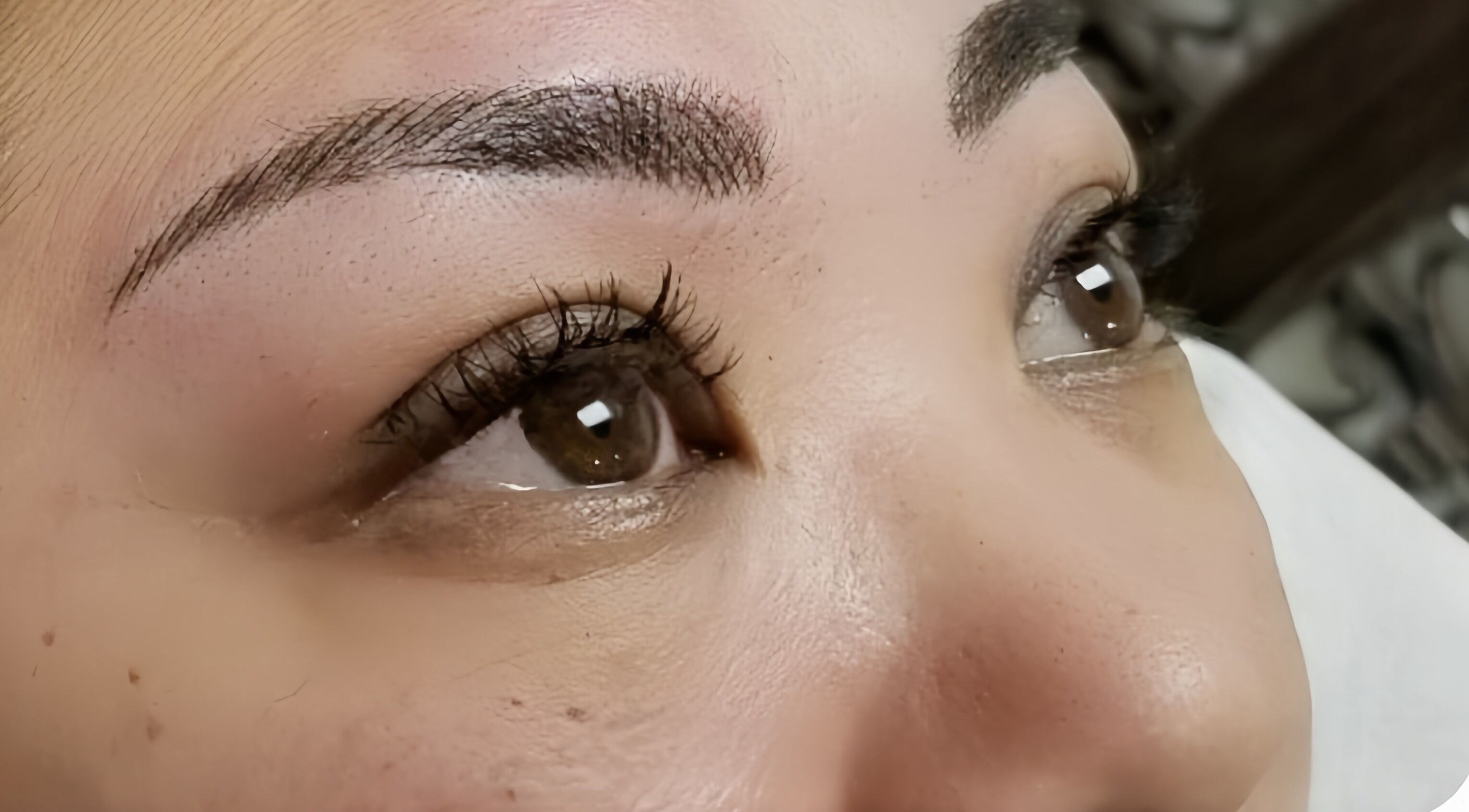 Close-up of expertly shaped brows and lashes at Lash n Brow by KT, Long Island City, New York, US.