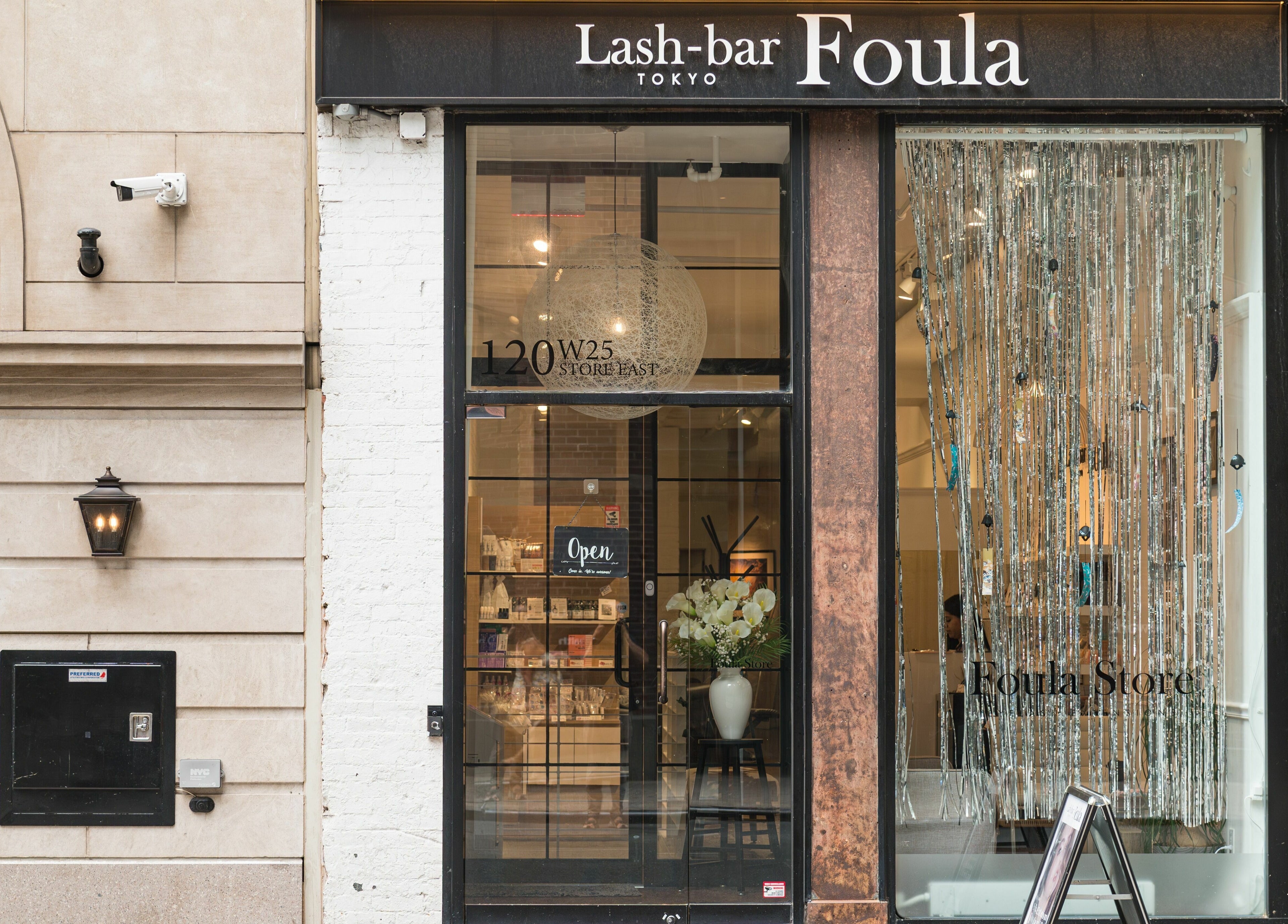 Front view of Lash-bar Foula in New York, New York, US, showcasing its elegant entrance and stylish decor.