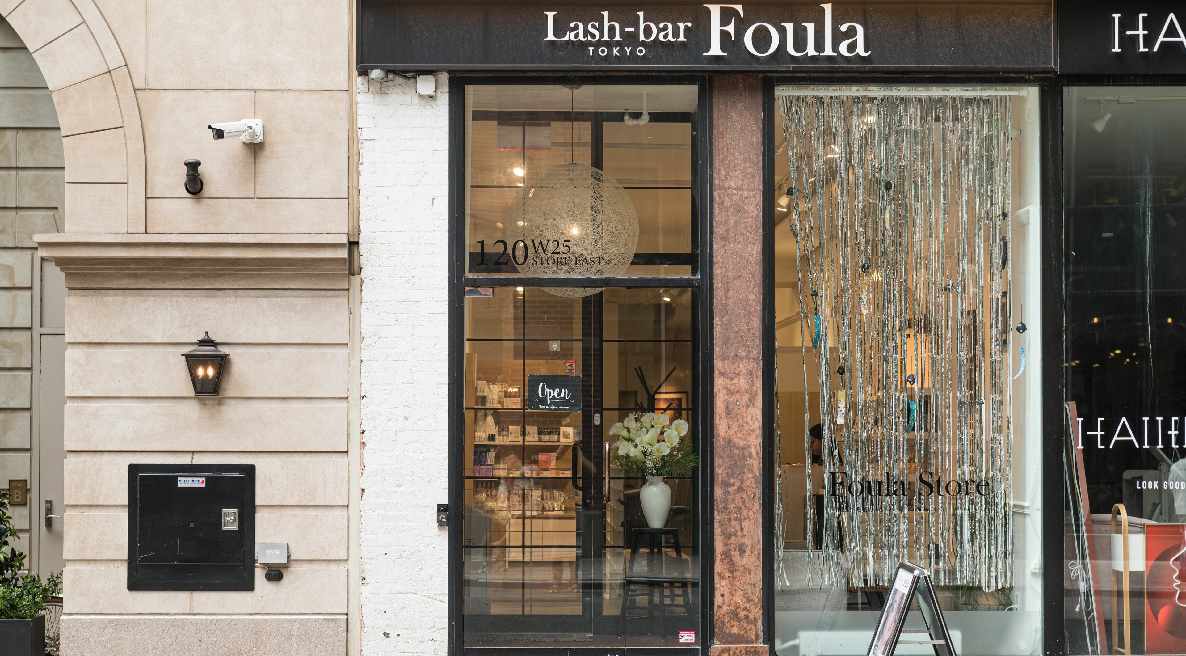 Front view of Lash-bar Foula in New York, New York, US, showcasing its elegant entrance and stylish decor.
