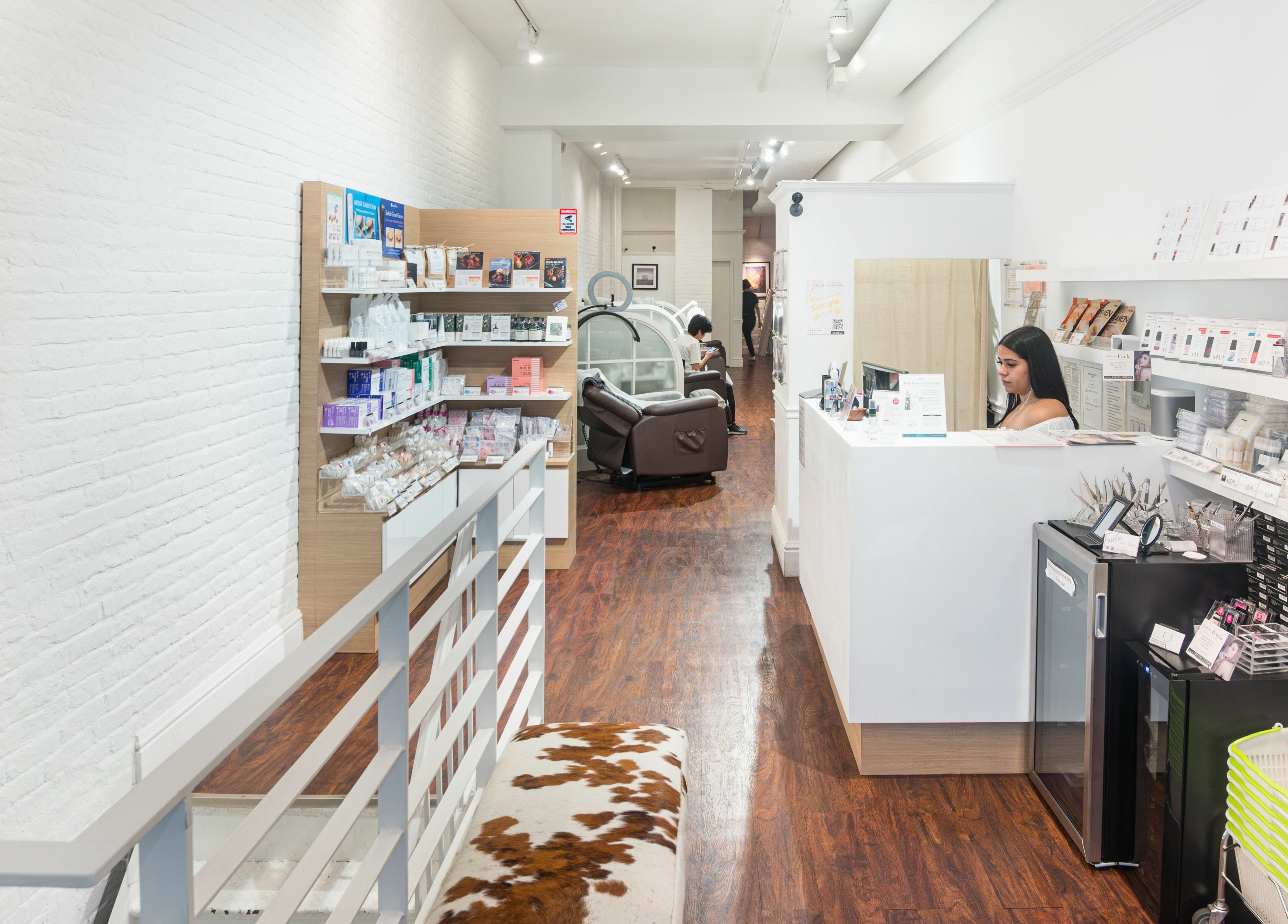 Inside Lash-bar Foula in New York, New York, US, featuring modern decor and beauty products.