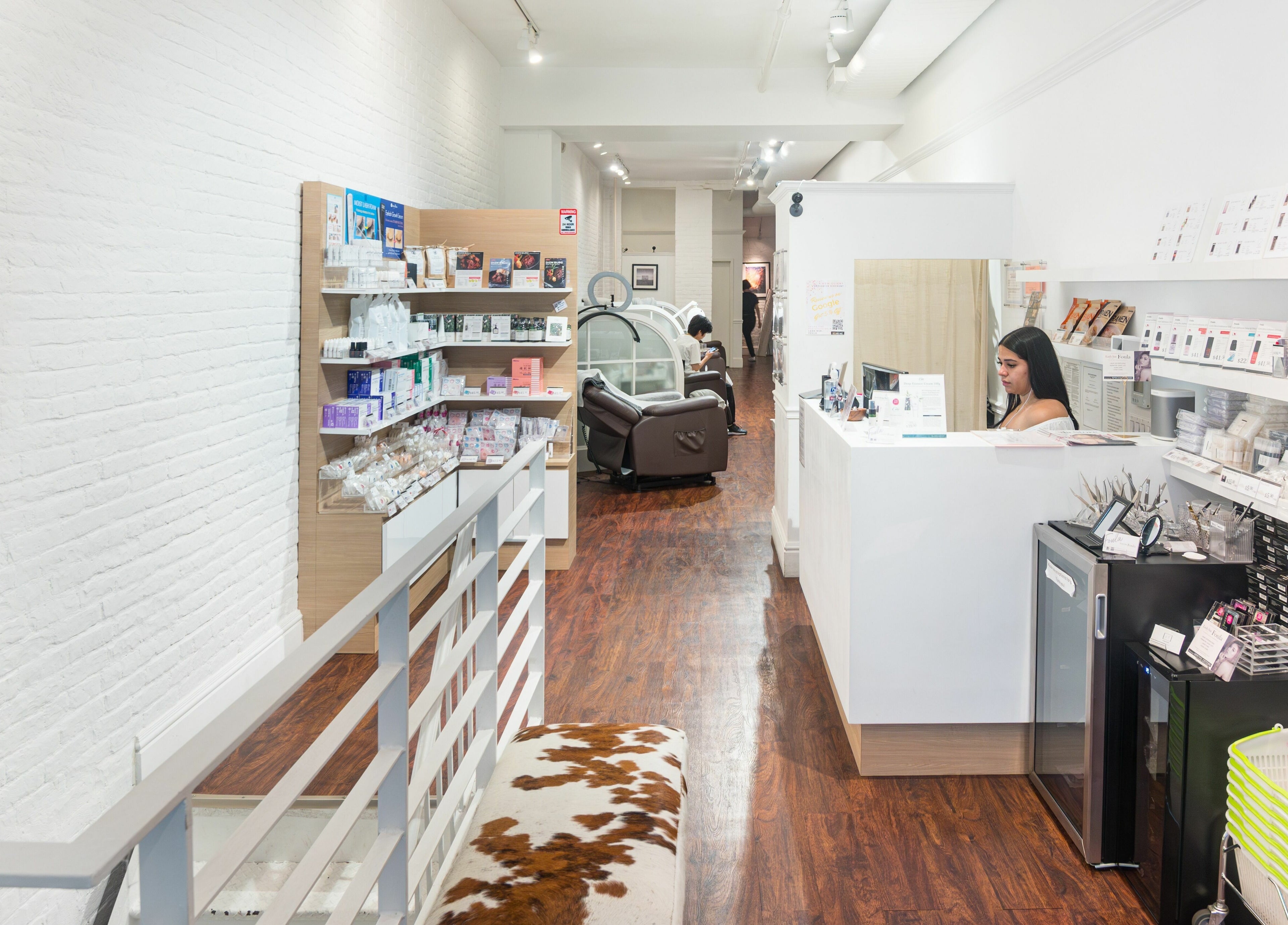Inside Lash-bar Foula in New York, New York, US, featuring modern decor and beauty products.