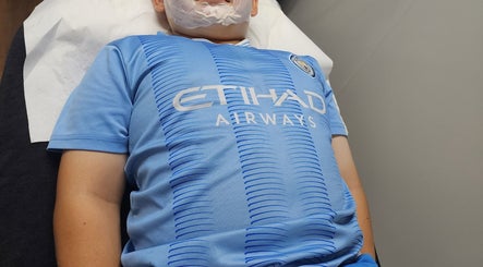 Client at Skinlisity receiving facial treatment in Balga, Western Australia for radiant skin rejuvenation.