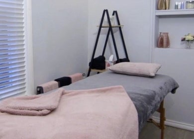 Relaxing treatment room at Belle Amour, Bagshot, England, GB with serene décor and soft linens.