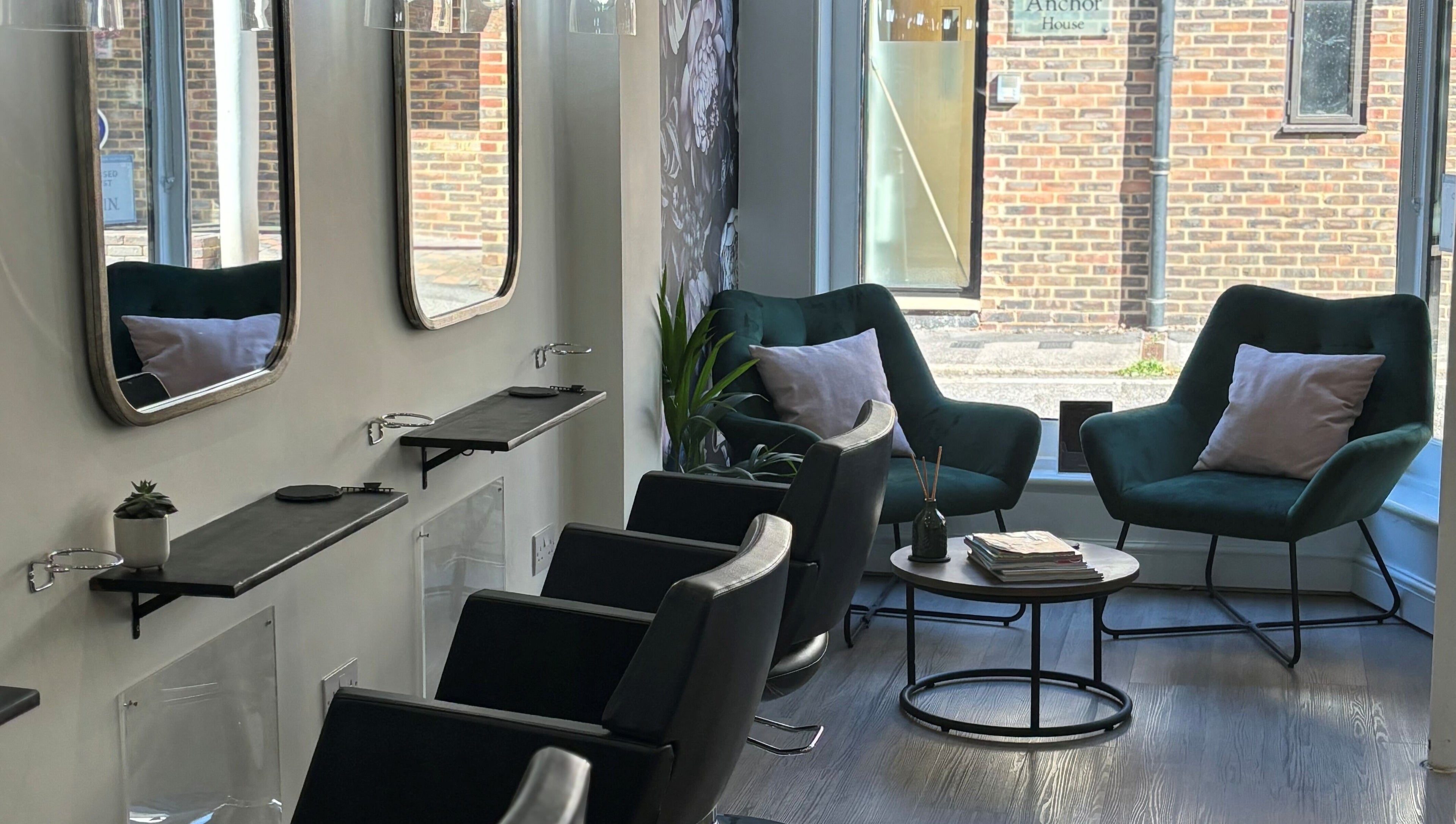 Cozy waiting area at Belle Amour, Bagshot, England, GB with plush chairs and modern decor.