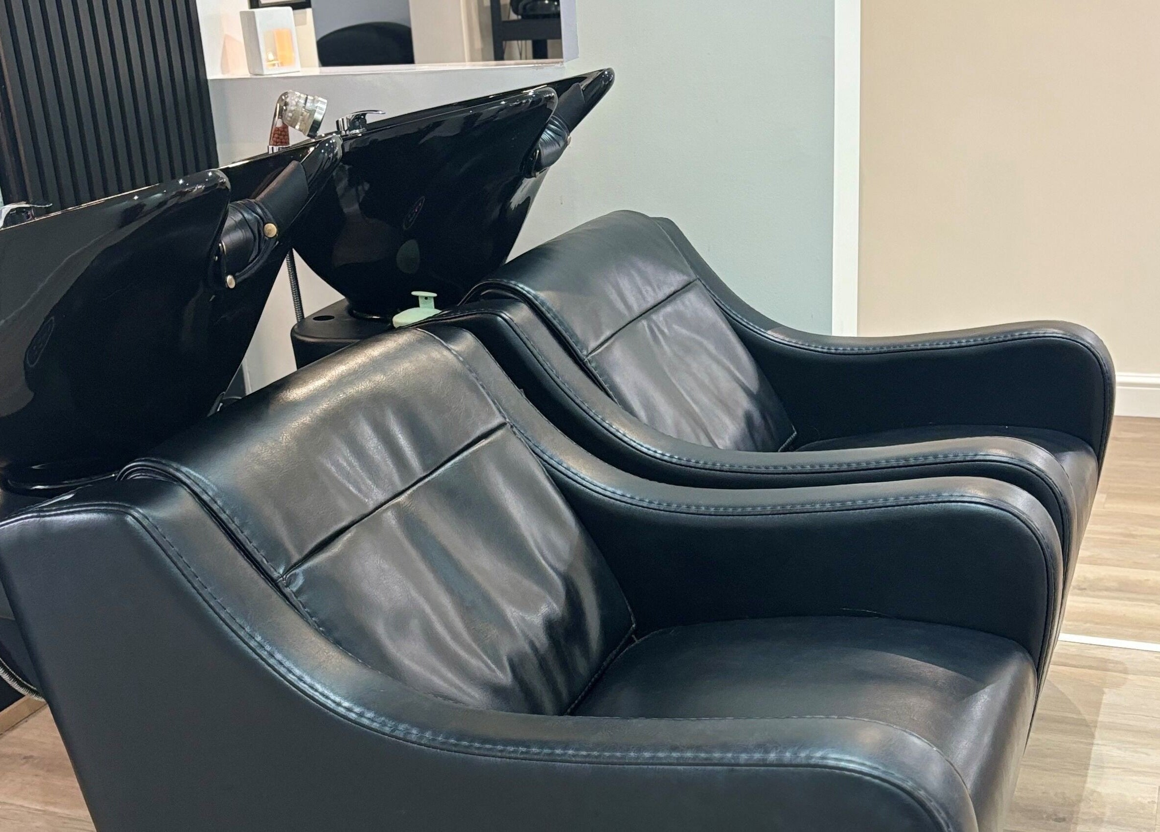 Luxurious wash stations at Belle Amour, Bagshot, England, GB. Comfortable leather chairs and sleek design.