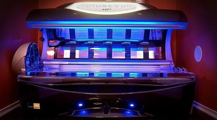 Sleek blue tanning bed at AfterGlow Tanning: Tiverton in Tiverton, Rhode Island, US.