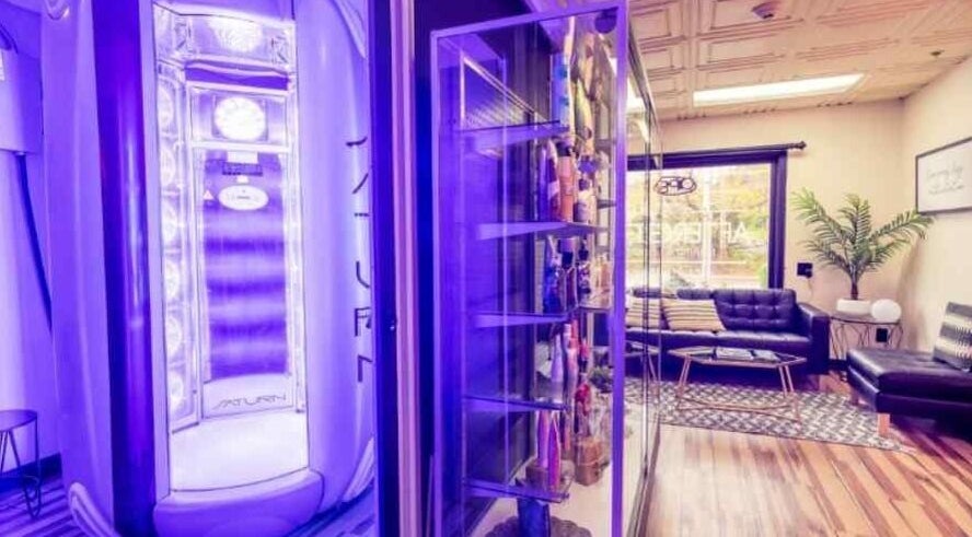 Modern tanning booth at AfterGlow Tanning: Tiverton, Tiverton, Rhode Island, US offers a sleek, welcoming ambiance.