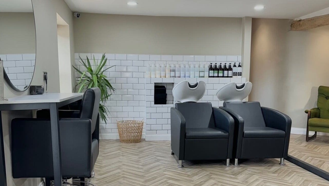 Modern salon interior at Lilys in Diss, England, GB featuring sleek chairs and stylish decor.