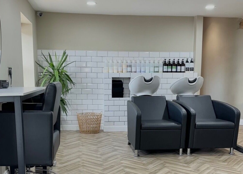 Modern salon interior at Lilys in Diss, England, GB featuring sleek chairs and stylish decor.