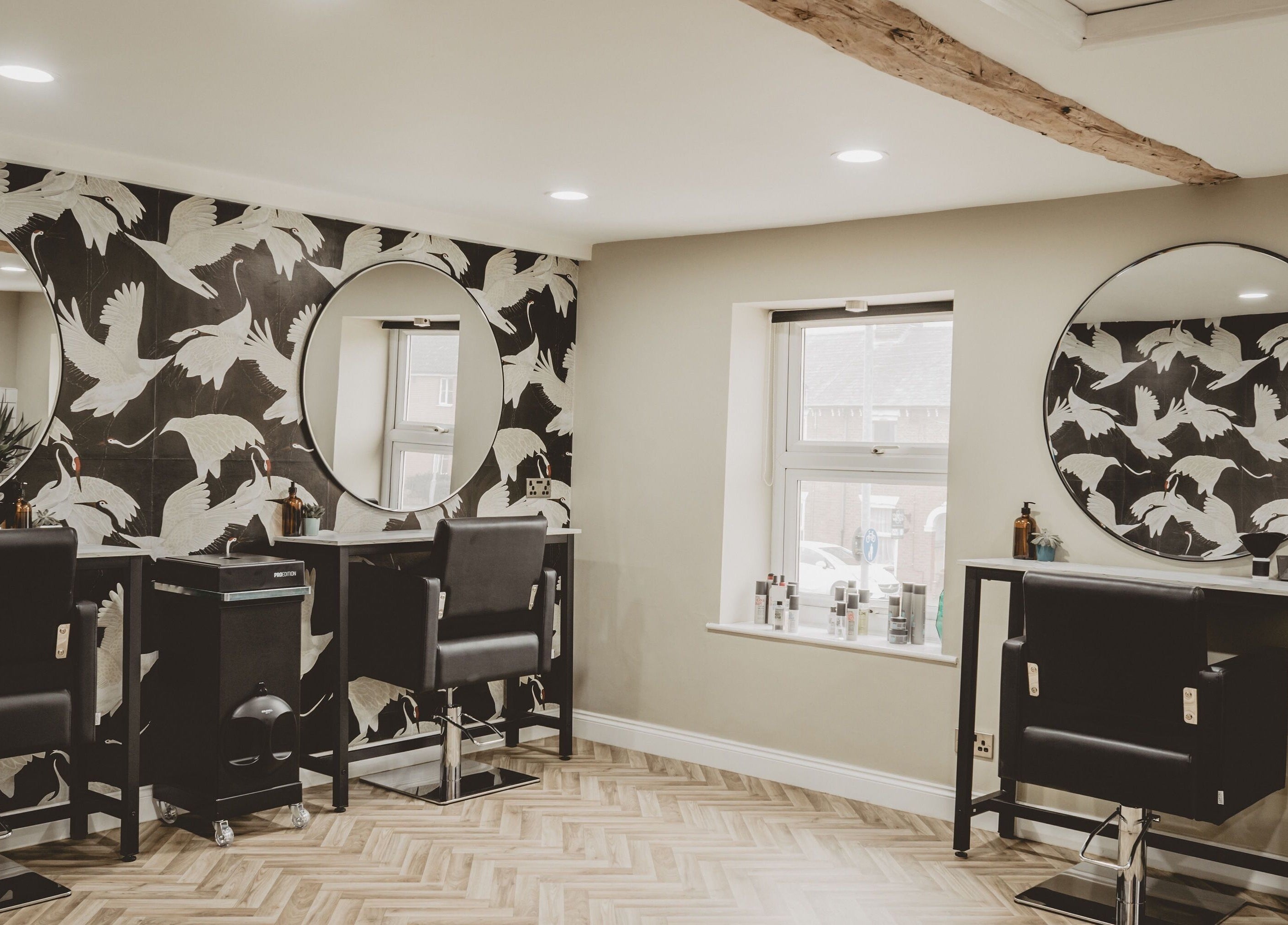 Chic salon interior at Lilys in Diss, England, GB with stylish chairs and modern decor.