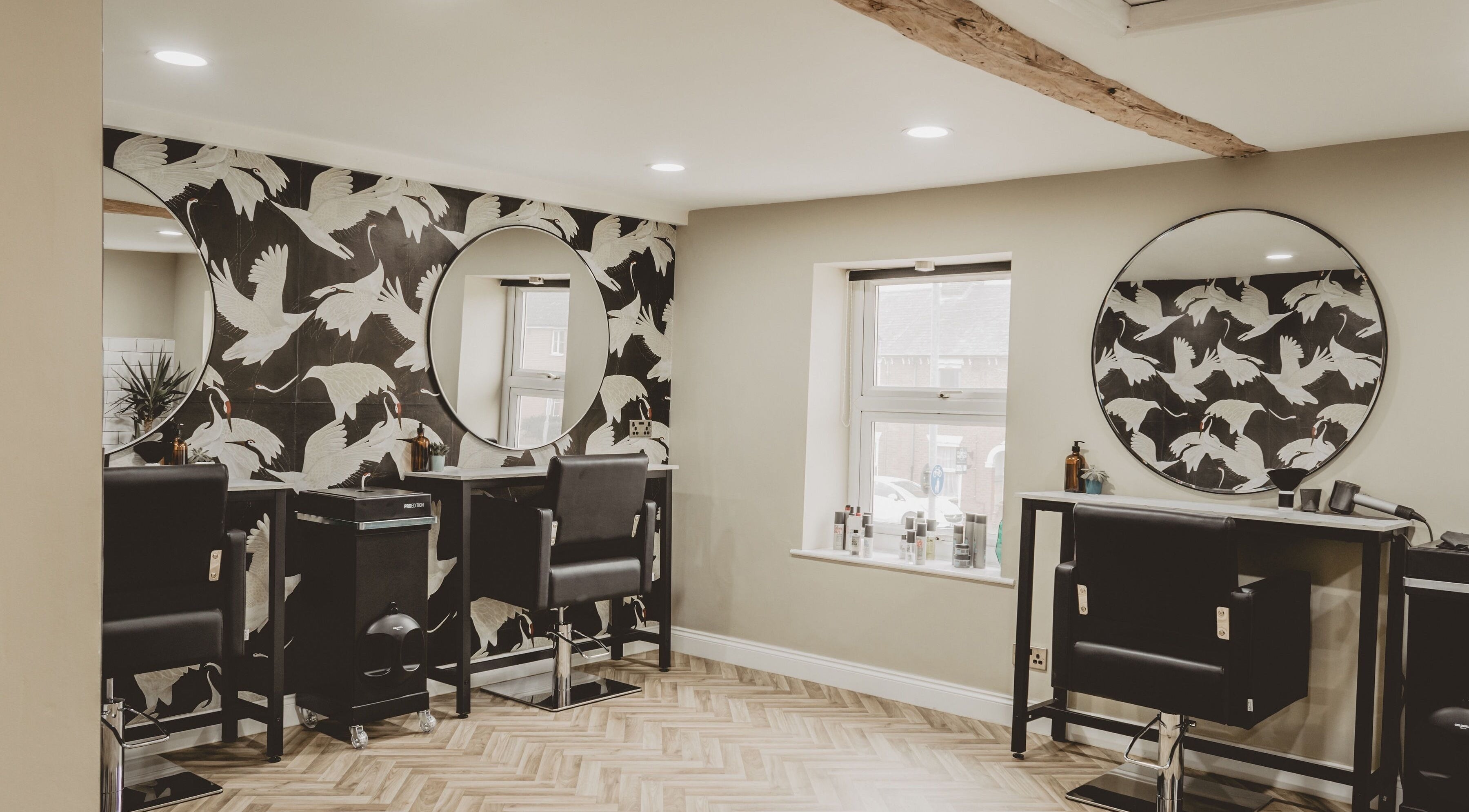 Chic salon interior at Lilys in Diss, England, GB with stylish chairs and modern decor.