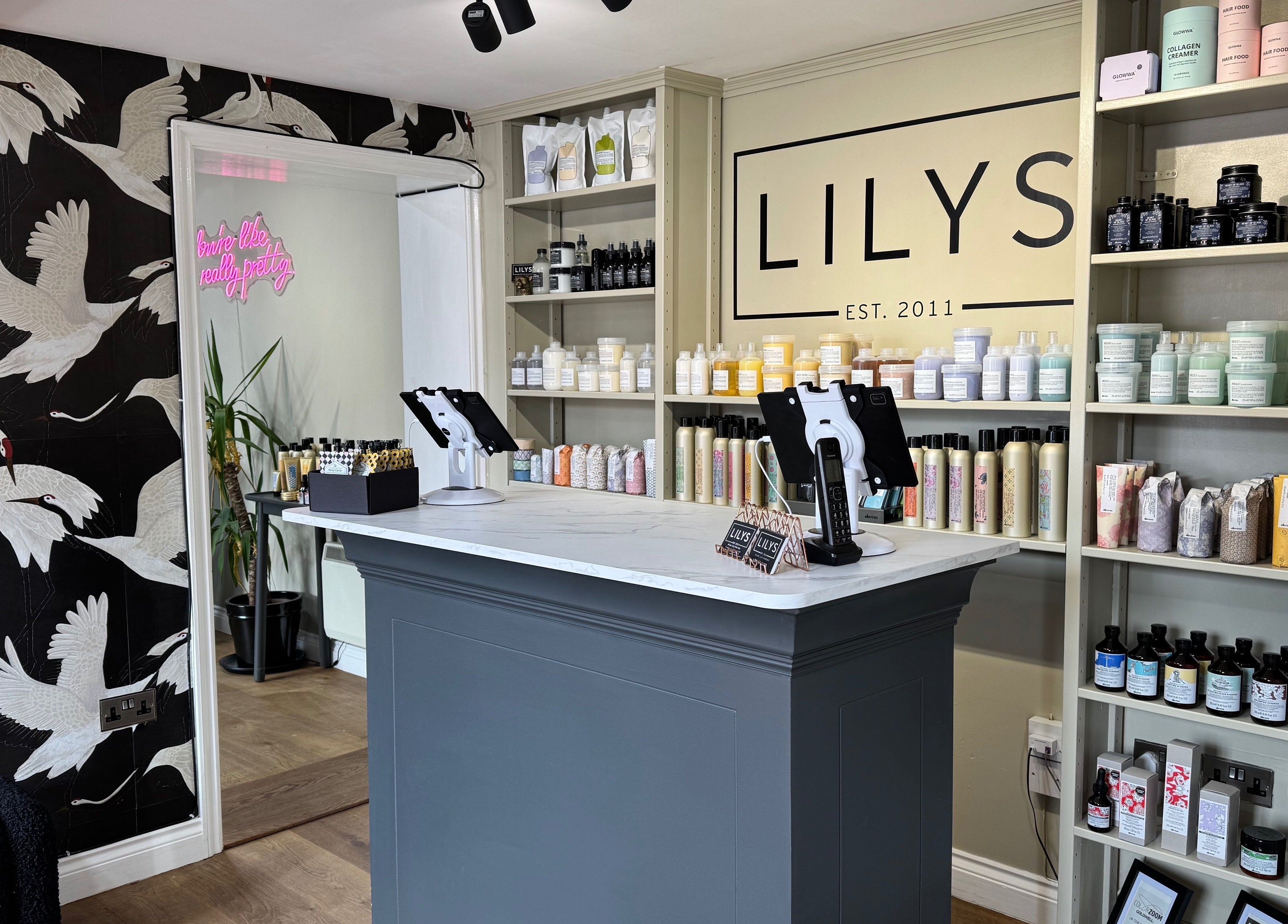 Stylish reception at Lilys, Diss, England, GB, with modern design and beauty products on display.