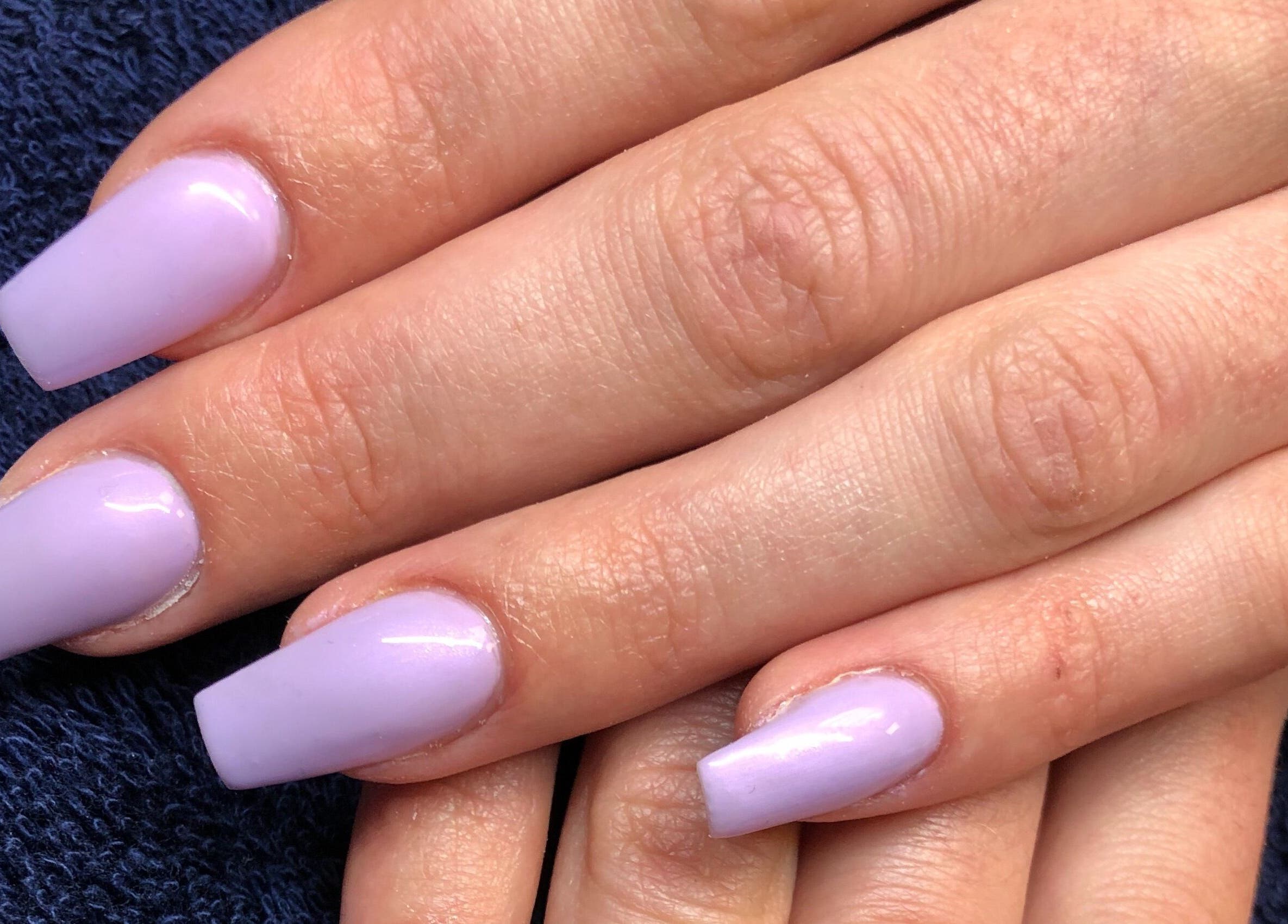 Lavender manicured nails at Needham Gym, Ipswich, England, GB. Perfect for a chic and polished look.
