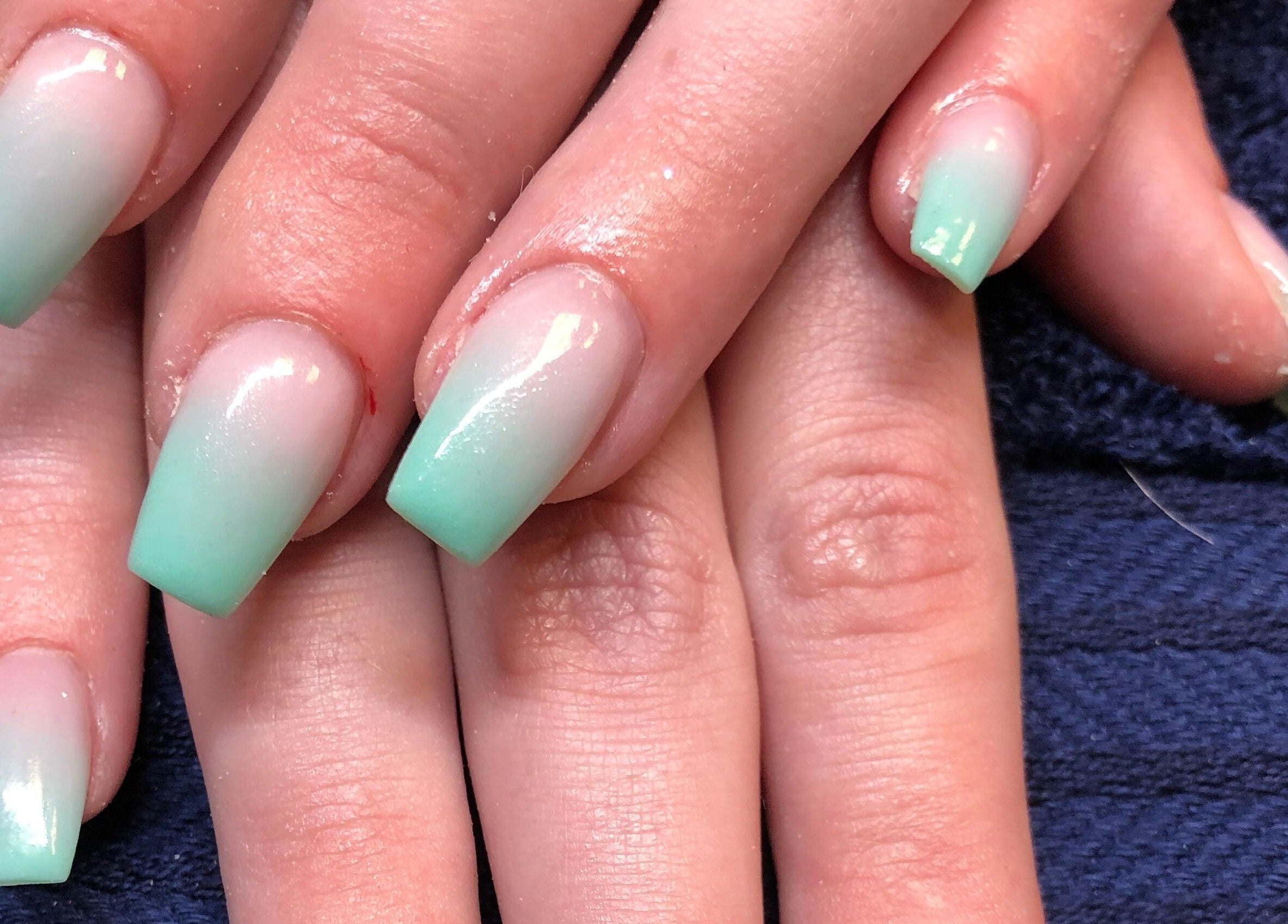 Mint gradient nails at Needham Gym in Ipswich, England, GB showcasing unique nail art design.