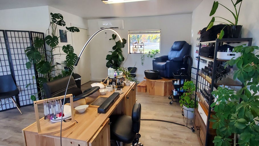 Inviting manicure and pedicure space at Royal Digits in Etna, California, US, adorned with lush greenery.